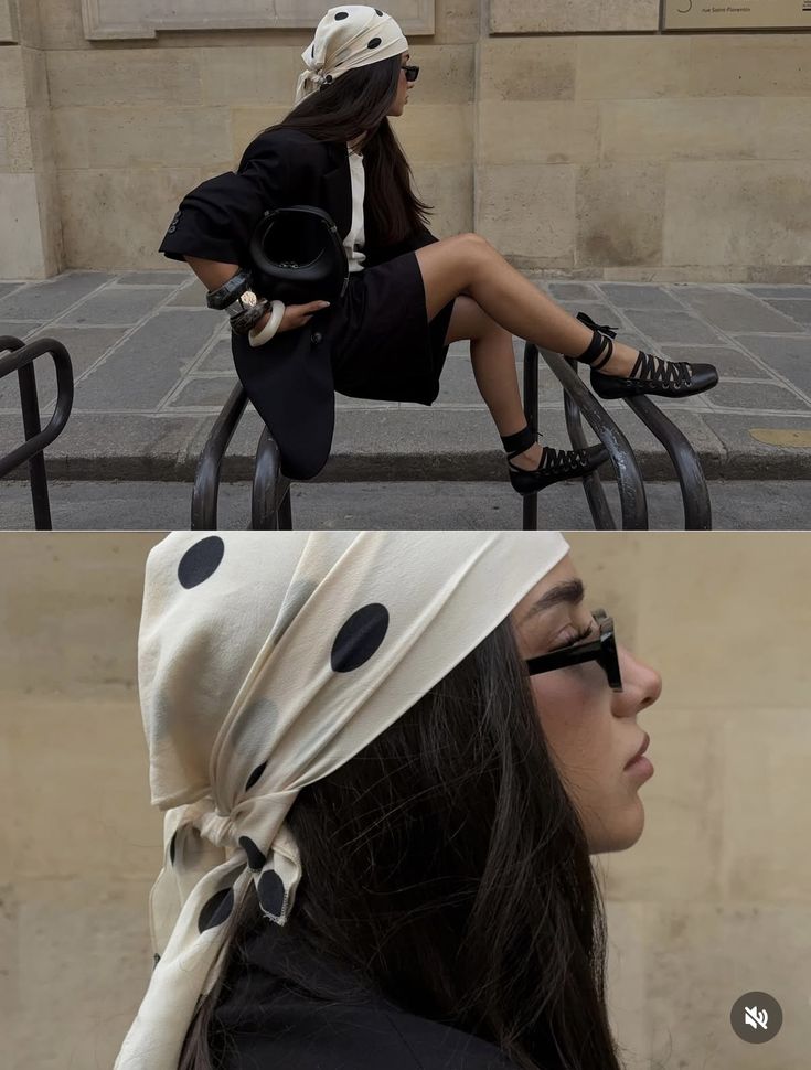 Woman in a black blazer and polka-dot headscarf perched on a railing in Paris